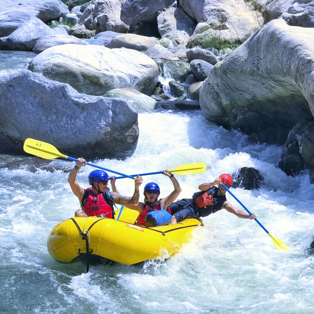 The Skog A Kust waterproof DrySaks dry bas are being used by a group whitewater rafting in a yellow raft